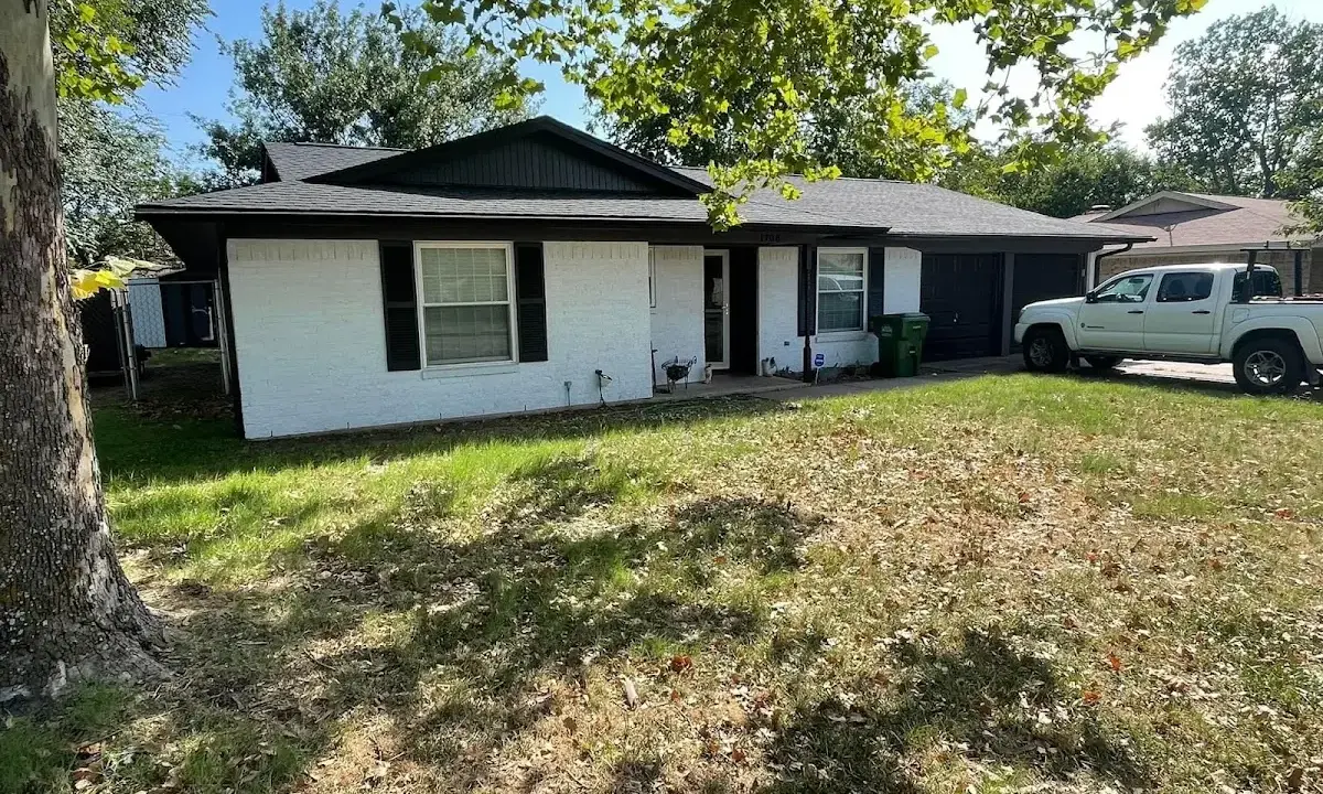 Professional roofing crew working on a residential roof in Berthoud